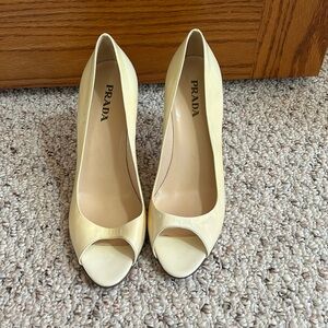Prada cream open toed pumps. 3 inch heels.